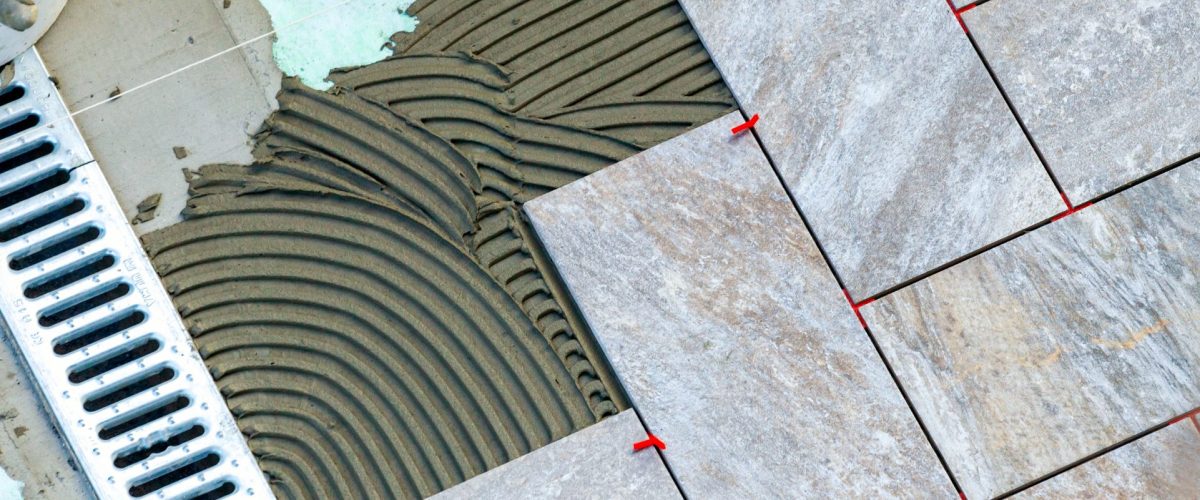 Laying garden paving with all the tools necessary for the tiler.